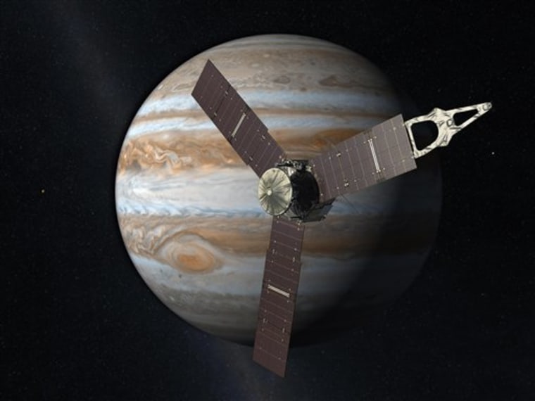 An artist's rendering shows the solar-powered NASA's Juno spacecraft with Jupiter in the background. Each of the solar panels is as big as a tractor-trailer truck.